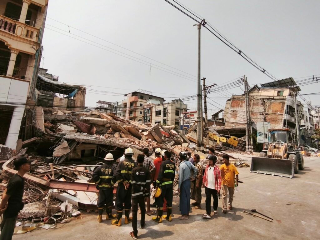 A rescue team searching for survivors amid the wreckage of the former Karaweik Cafe in Mandalay. (Photo: Ko Doe Mikko facebook post)